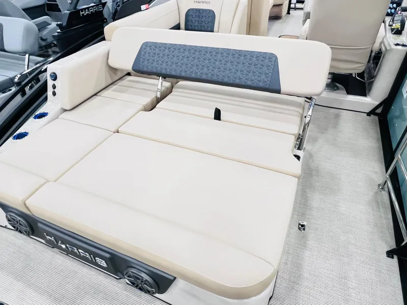 Slide: The Image of 2025 Harris Solstice 250 boat interior with beige seating and modern design. - 11