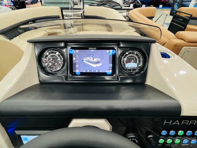 Slide: The Image of 2025 Harris Solstice 250 dashboard with digital display and gauges in a luxury boat interior. - 14