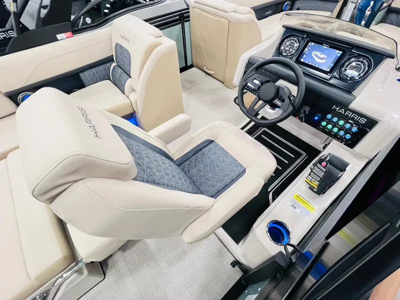 Slide: The Image of Luxurious interior of 2025 Harris Solstice 250 boat with modern dashboard and plush seating. - 15
