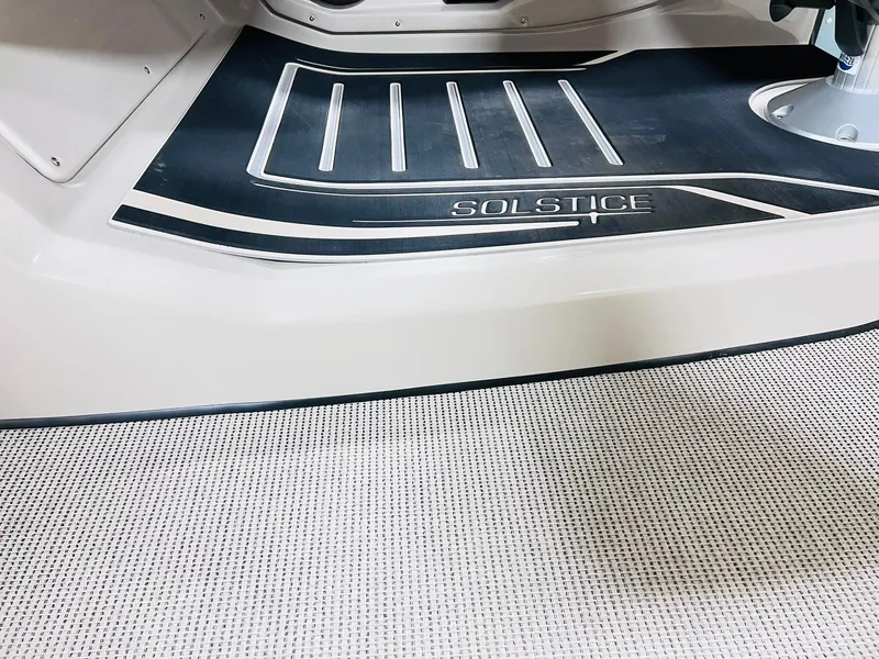 Slide: The Image of 2025 Harris Solstice 250 boat interior with sleek flooring design. - 18