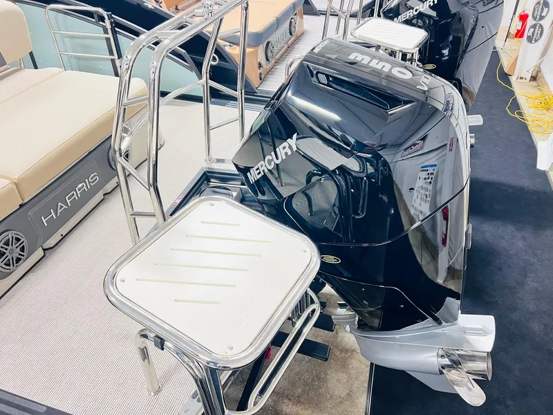 Slide: The Image of 2025 Harris Solstice 250 boat with Mercury outboard motor and seating area. - 20