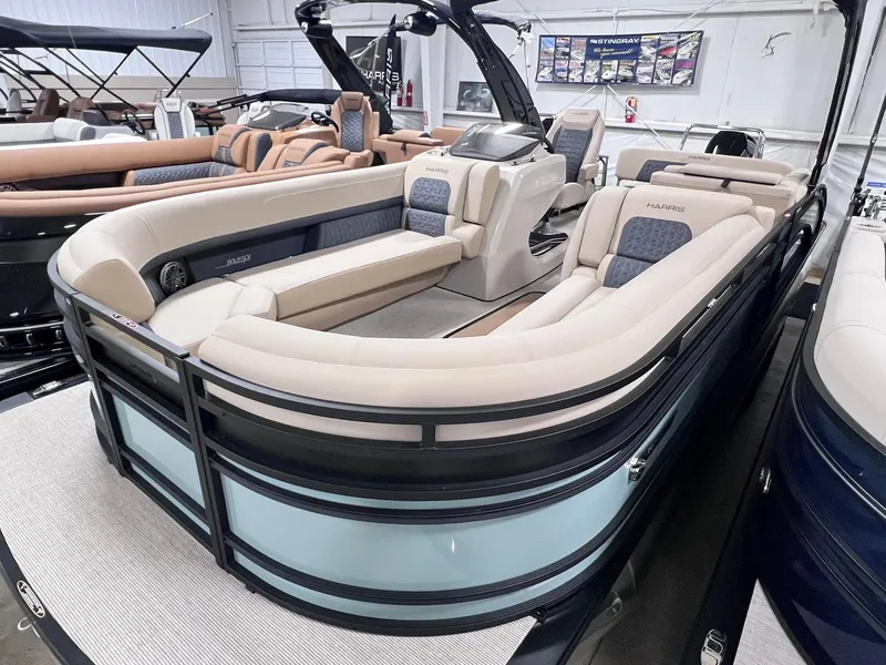 Slide: The Image of 2025 Harris Solstice 250 pontoon boat with luxurious seating in showroom. - 3