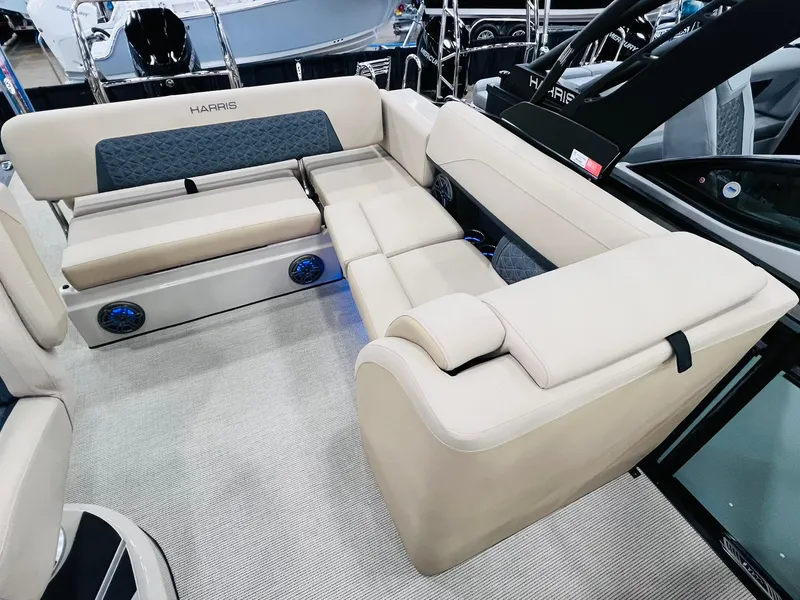 Slide: The Image of 2025 Harris Solstice 250 boat interior with beige seating and modern design. - 8