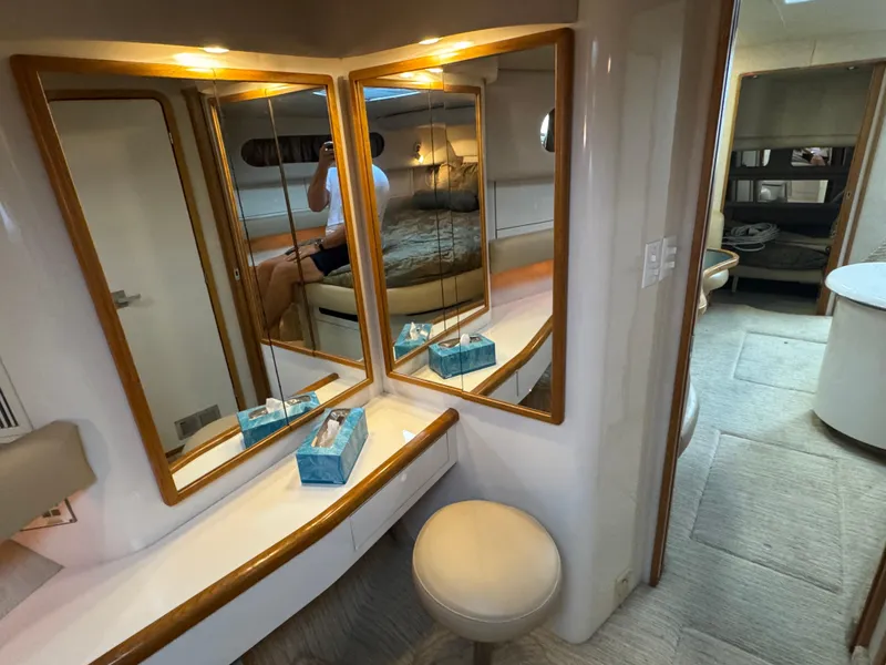 Slide: The Image of Interior of 1995 Sea Ray 450 Sundancer with mirrors and seating area. - 18
