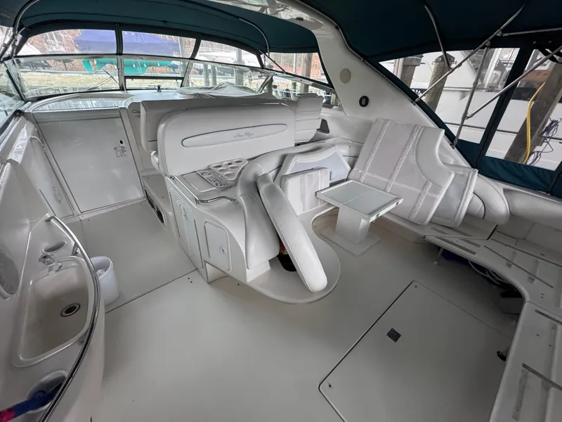Slide: The Image of 1995 Sea Ray 450 Sundancer interior with white seating and modern design. - 6