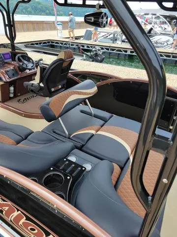 Slide: The Image of 2025 Aloha 30' Paradise Sundeck with luxurious seating and modern dashboard. - 14