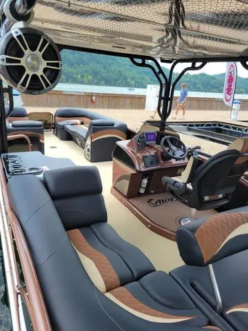 Slide: The Image of 2025 Aloha 30' Paradise Sundeck boat with luxurious seating and modern design. - 24