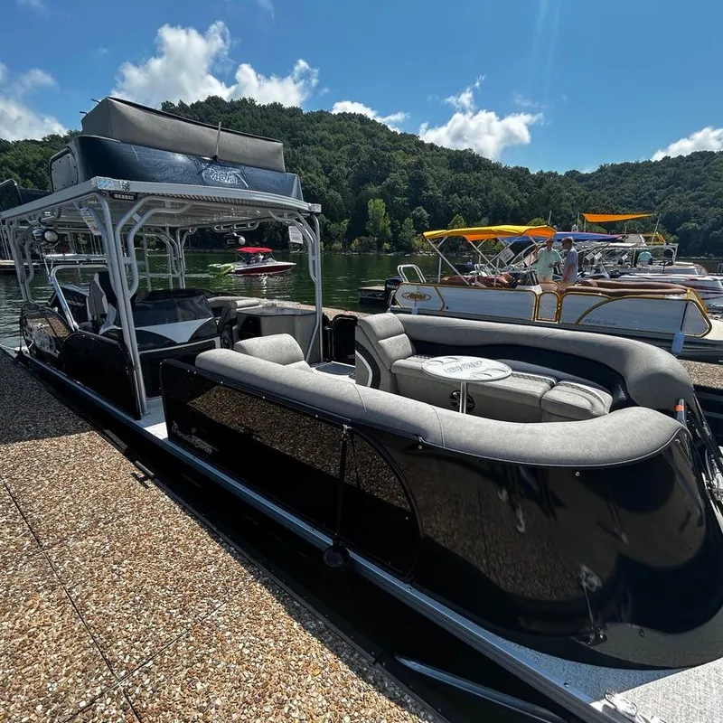 Slide: The Image of 2025 Aloha 30' Paradise Sundeck boat docked on a sunny day by a lake. - 3