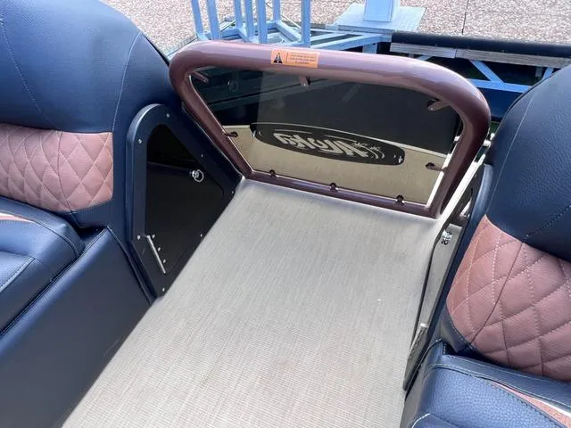 Slide: The Image of Interior of 2025 Aloha 30' Paradise Sundeck with blue and brown seating. - 32