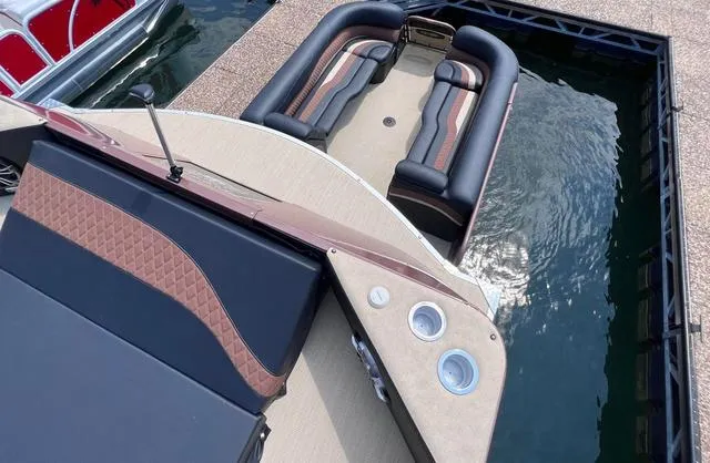 Slide: The Image of 2025 Aloha 30' Paradise Sundeck boat docked, featuring luxurious seating and sleek design. - 34
