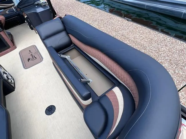 Slide: The Image of 2025 Aloha 30' Paradise Sundeck with luxurious seating and storage compartment. - 39
