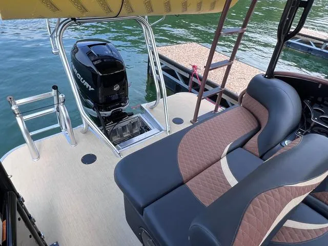 Slide: The Image of 2025 Aloha 30' Paradise Sundeck with motor, luxurious seating, and lake view. - 41