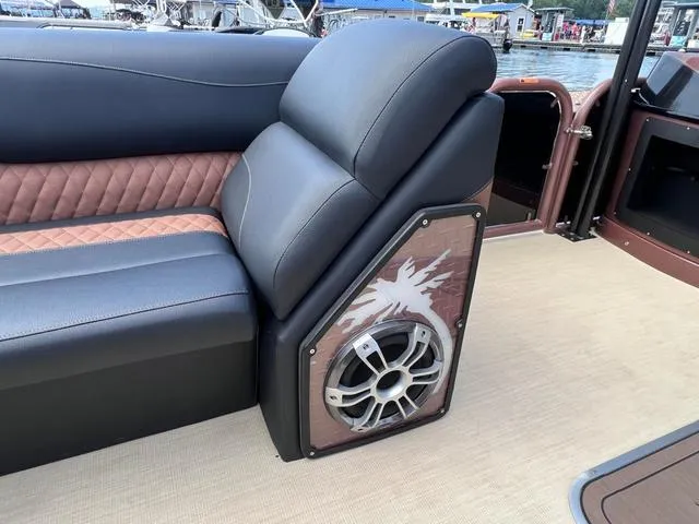 Slide: The Image of 2025 Aloha 30' Paradise Sundeck with luxurious seating and integrated speaker system. - 44