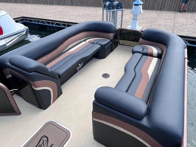 Slide: The Image of 2025 Aloha 30' Paradise Sundeck with luxurious seating on a docked boat. - 45