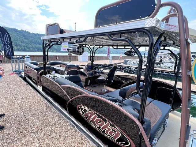 Slide: The Image of 2025 Aloha 30' Paradise Sundeck boat docked, showcasing luxurious seating and modern design. - 47