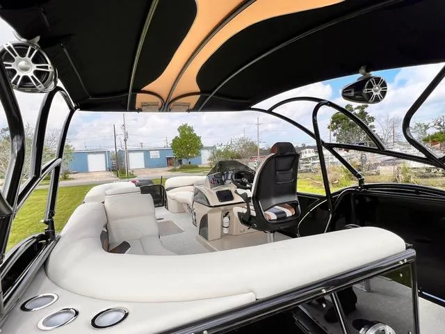 Slide: The Image of Interior of 2025 Aloha 23' Paradise Arch Sport Tower boat with sleek seating and modern controls. - 10