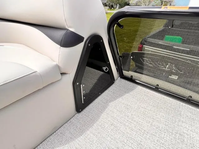 Slide: The Image of Interior of 2025 Aloha 23' Paradise Arch Sport Tower boat, featuring seating and storage. - 16