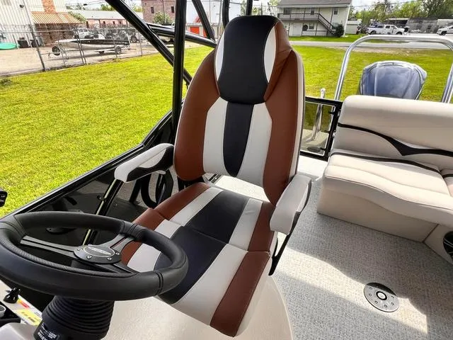 Slide: The Image of Captain's chair on 2025 Aloha 23' Paradise Arch Sport Tower boat, featuring sleek design and comfortable seating. - 24
