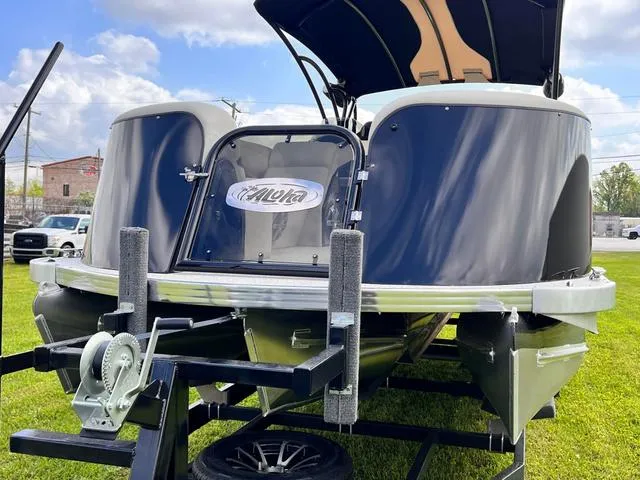 Slide: The Image of 2025 Aloha 23' Paradise Arch Sport Tower boat on trailer, displayed outdoors. - 27