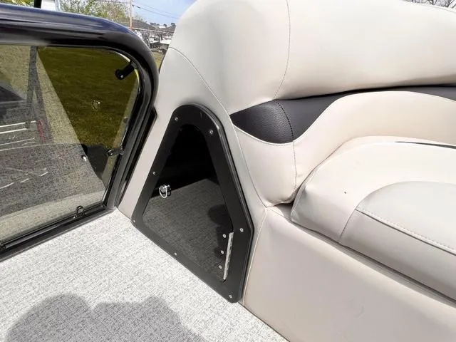 Slide: The Image of Interior of 2025 Aloha 23' Paradise Arch Sport Tower boat, featuring plush seating. - 7