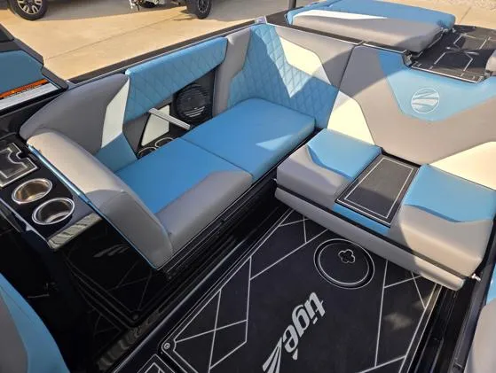 Slide: The Image of 2025 Tigé Z3 boat interior with blue and gray seating, cup holders, and stylish design. - 10