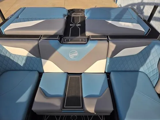 Slide: The Image of 2025 Tigé Z3 boat interior with blue and gray seating, modern design. - 13