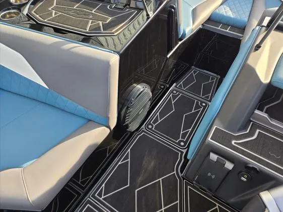 Slide: The Image of 2025 Tigé Z3 boat interior with stylish seating and geometric floor design. - 5