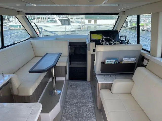 Slide: The Image of Interior of 2021 Regal 38 XO yacht with modern seating and helm. - 32