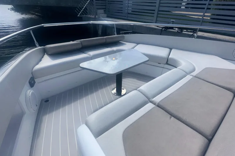 Slide: The Image of 2021 Azimut Verve 47 yacht with sleek seating and table on deck. - 17