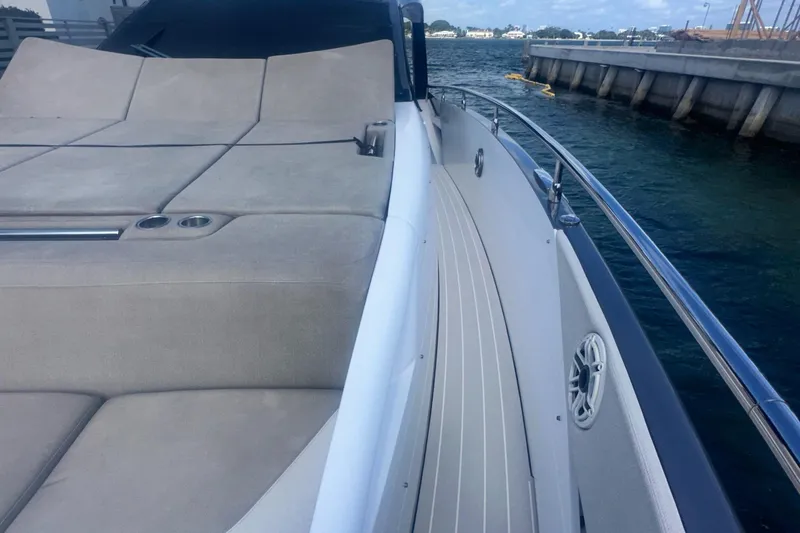 Slide: The Image of 2021 Azimut Verve 47 yacht with spacious deck and luxurious seating by the water. - 18