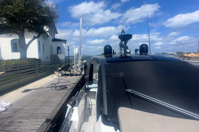 Slide: The Image of Azimut Verve 47 yacht docked, 2021 model, under a clear blue sky. - 19