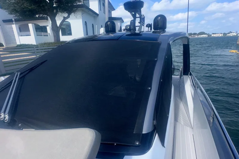 Slide: The Image of 2021 Azimut Verve 47 yacht docked by waterfront, showcasing sleek design and modern features. - 20