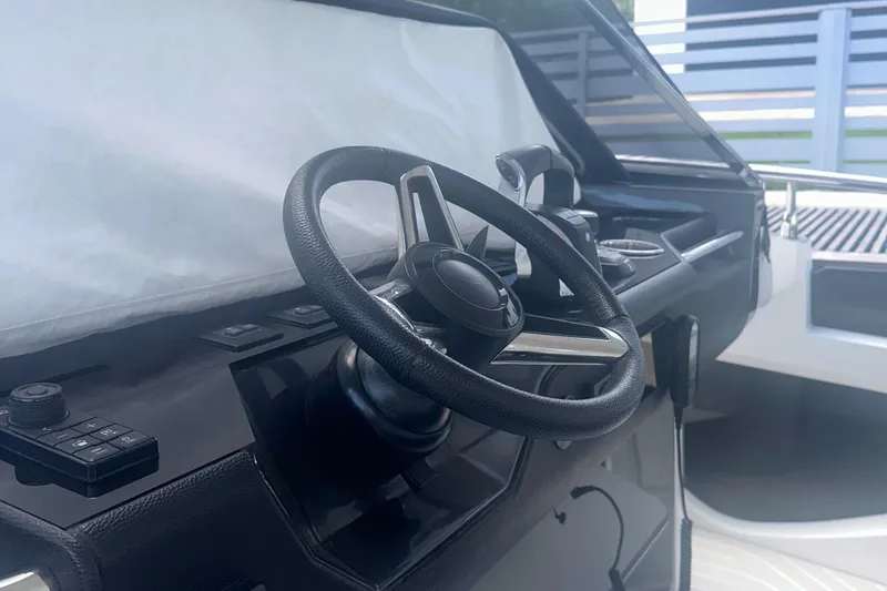 Slide: The Image of Steering wheel of 2021 Azimut Verve 47 yacht, showcasing modern design and controls. - 27