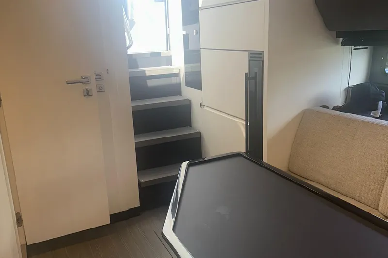 Slide: The Image of Interior of 2021 Azimut Verve 47 yacht, featuring modern design and staircase. - 34