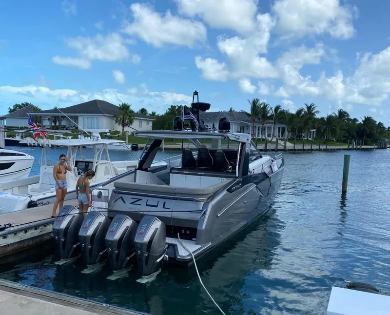 Slide: The Image of Azimut Verve 47 yacht docked, 2021 model, with four engines, in a scenic marina. - 5