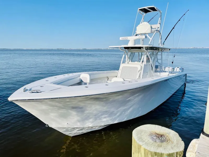 Slide: The Image of 2020 SeaHunter 39 Tournament boat on water, clear sky, fishing rods visible. - 1