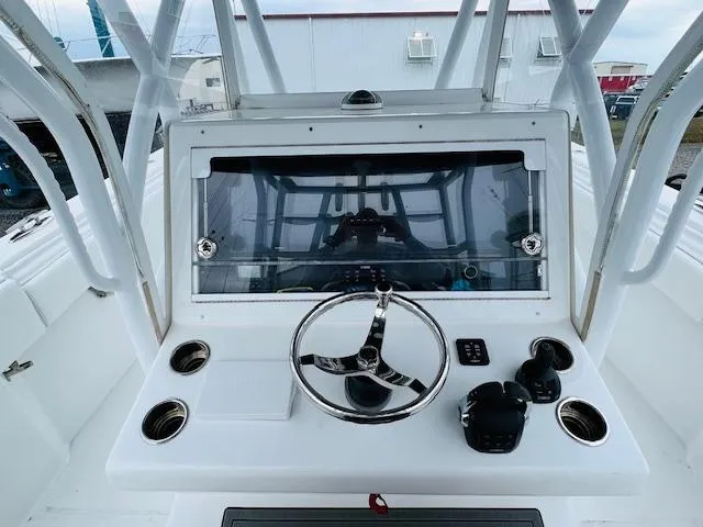 Slide: The Image of SeaHunter 39 Tournament 2020 boat interior with cushioned seating and rod holders. - 24