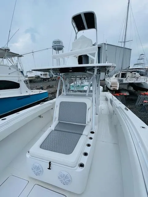 Slide: The Image of 2020 SeaHunter 39 Tournament boat interior with cushioned seating and storage compartments. - 27