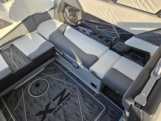 Slide: The Image of 2025 Tigé Ultré 23ZX interior with sleek seating and modern design elements. - 12
