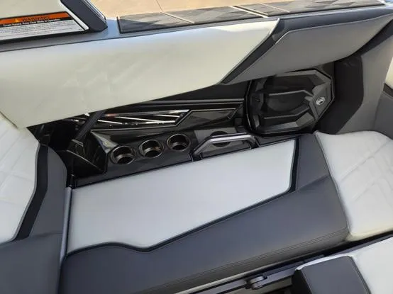 Slide: The Image of Interior of 2025 Tigé Ultré 23ZX boat, featuring sleek seating and cup holders. - 6