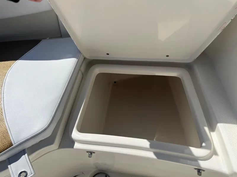 Slide: The Image of Open storage compartment on 2022 Bulls Bay 230 Center Console boat. - 12