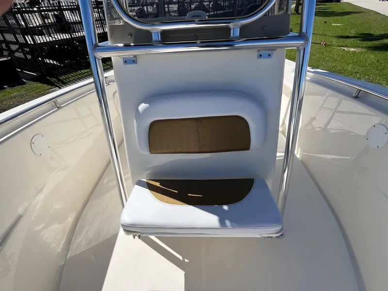 Slide: The Image of 2022 Bulls Bay 230 Center Console boat interior with seating and storage. - 7