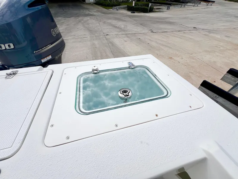 Slide: The Image of 2019 Parker 2300 Center Console boat with Yamaha engine, featuring a livewell on deck. - 10