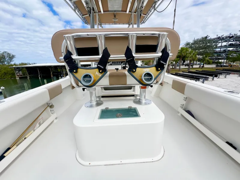 Slide: The Image of 2019 Parker 2300 Center Console boat interior with rod holders and seating. - 11