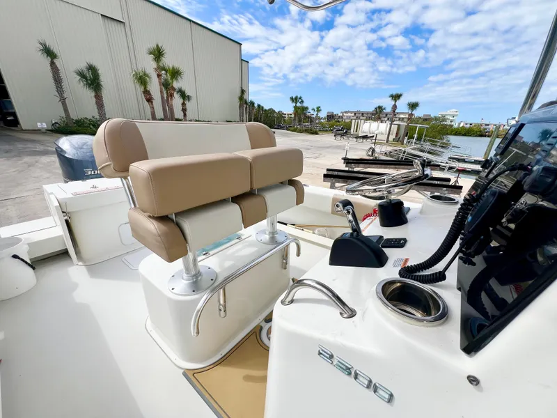 Slide: The Image of 2019 Parker 2300 Center Console boat interior with seating and control panel. - 13