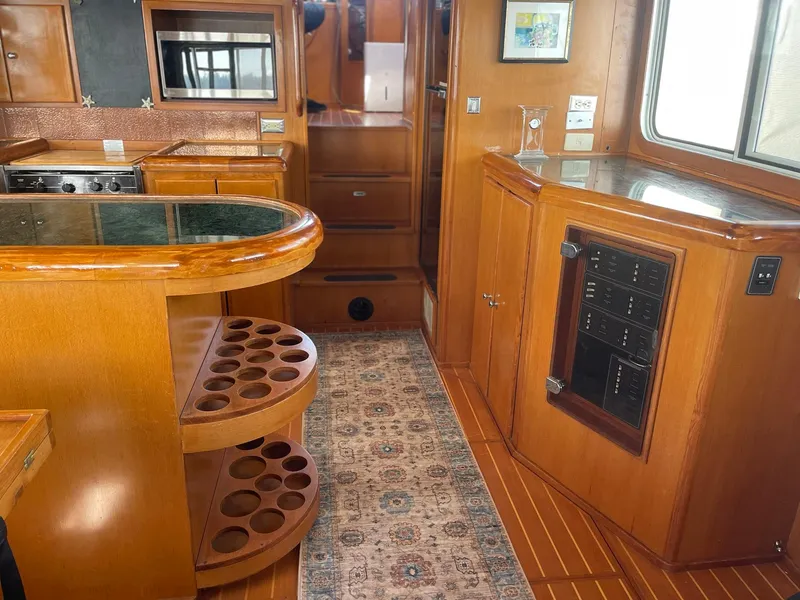 Slide: The Image of Luxurious 2002 Transpacific Marine EAGLE 53 yacht interior with wood cabinetry and modern amenities. - 12