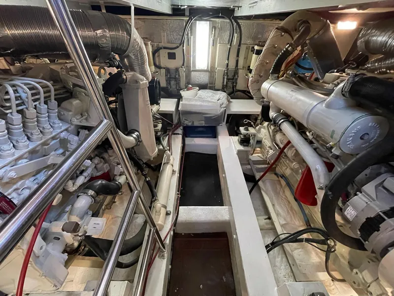 Slide: The Image of Engine room of 2002 Transpacific Marine EAGLE 53 yacht, showcasing mechanical components and piping. - 2