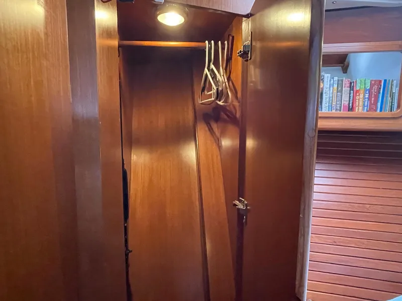 Slide: The Image of Wooden closet interior with hangers, aboard 2002 Transpacific Marine EAGLE 53 yacht. - 26