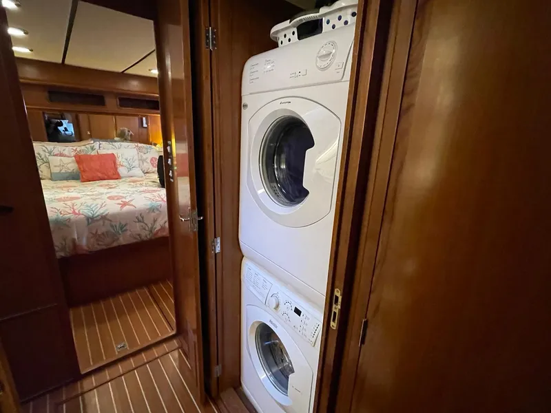 Slide: The Image of Laundry area on 2002 Transpacific Marine EAGLE 53 yacht, with stacked washer and dryer. - 28