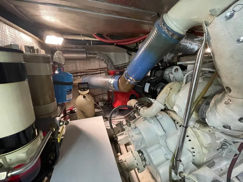 Slide: The Image of Engine room of 2002 Transpacific Marine EAGLE 53 yacht, showcasing mechanical components and piping. - 3